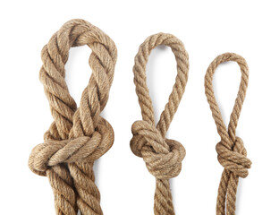 Hemp ropes with loops on white background, top view