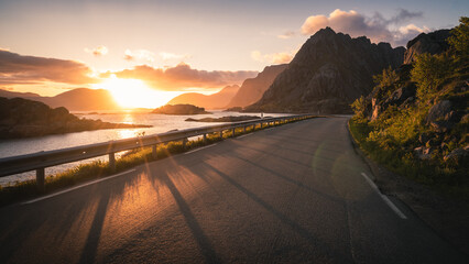 Mountain road at beautiful sunset in Lofoten Islands, Norway.