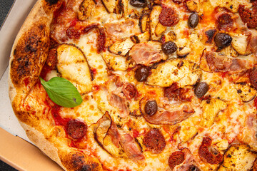 pizza chicken meat, sausages, olives, cheese, tomato sauce.fresh meal food snack on the table copy space food background rustic top view
