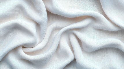 Obraz premium A close-up of soft white fabric displaying elegant folds and texture, ideal for backgrounds and design projects.
