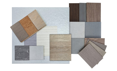 top view of interior material samples board contains ash vinyl flooring tile, stone ceramic tiles, interior fabric wallpapers, wooden laminated flooring isolated on background with clipping path.