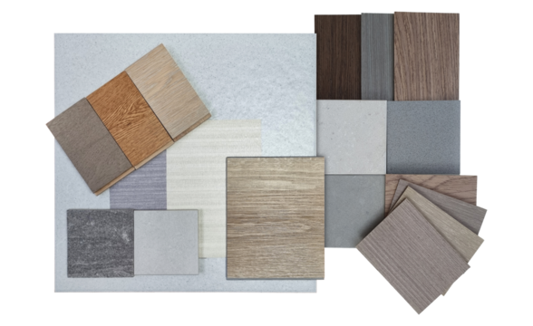 top view of interior material samples board contains ash vinyl flooring tile, stone ceramic tiles, interior fabric wallpapers, wooden laminated flooring isolated on background with clipping path.