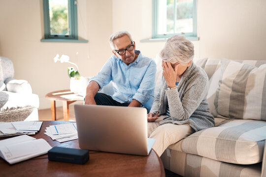 Frustrated, old couple and laptop for finance, stress and argument with gambling debt. Apartment, pc and documents with man, woman and home loan with inflation, bankruptcy and conflict for mortgage