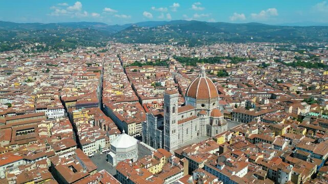 An aerial view of Florence, Italy, captured by a drone, highlighting the city's stunning Renaissance architecture and iconic landmarks. Florence, the cradle of the Renaissance, is renowned for it