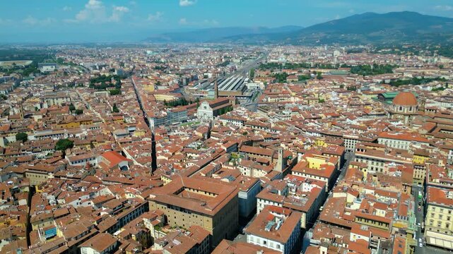 An aerial view of Florence, Italy, captured by a drone, highlighting the city's stunning Renaissance architecture and iconic landmarks. Florence, the cradle of the Renaissance, is renowned for it