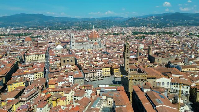 An aerial view of Florence, Italy, captured by a drone, highlighting the city's stunning Renaissance architecture and iconic landmarks. Florence, the cradle of the Renaissance, is renowned for it