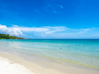 Seascape view with white sand, quiet beach, clear sea water, blue sky in summer of Koh Samet (Samet Isalnd) in Thailand