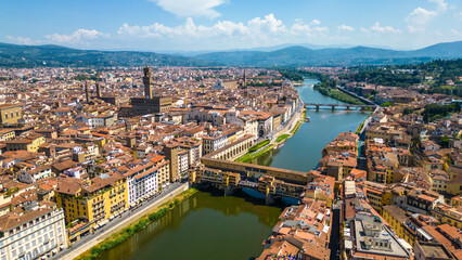 Obraz premium An aerial view of Florence, Italy, captured by a drone, highlighting the city's stunning Renaissance architecture and iconic landmarks. Florence, the cradle of the Renaissance, is renowned for it