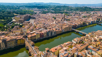 Obraz premium An aerial view of Florence, Italy, captured by a drone, highlighting the city's stunning Renaissance architecture and iconic landmarks. Florence, the cradle of the Renaissance, is renowned for it
