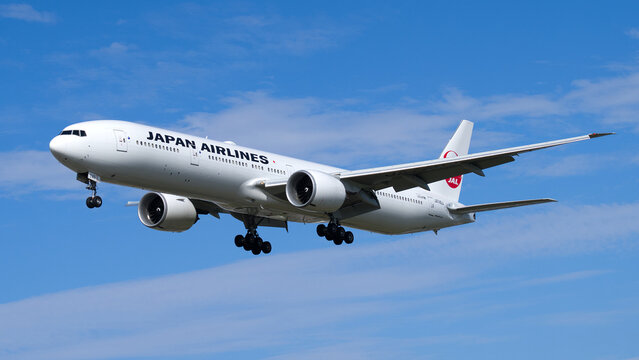 Japan Airlines JAL Boeing 777 coming into land with a blue sky. London - 29th August 2024