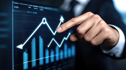 Innovative businessman analyzes digital growth metrics as he points to an upward trend in a modern workspace