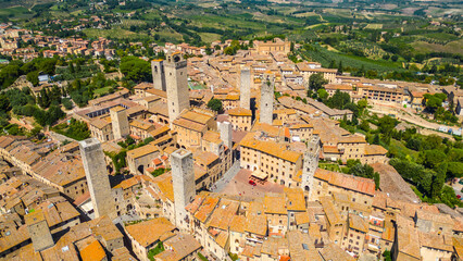 Fototapeta premium An aerial view of Certaldo, a charming medieval town in Tuscany, Italy, captured by a drone. Certaldo is known for its well-preserved historic center, characterized by ancient brick buildings