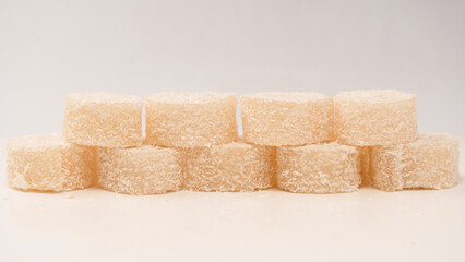 Coconut candy roll isolated on a white background.