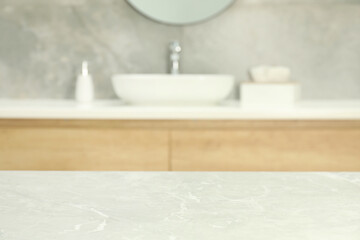Empty light grey marble table in bathroom. Space for design