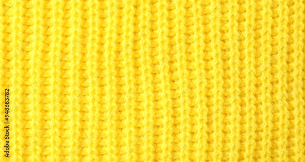 Poster Texture of yellow knitted fabric as background, top view