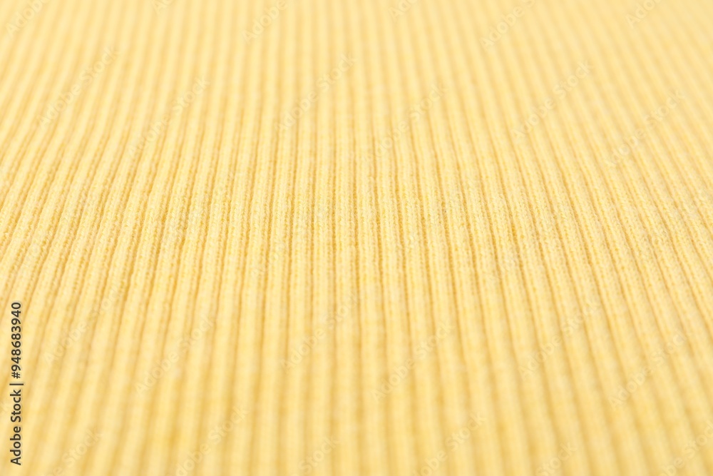 Wall mural Texture of light yellow knitted fabric as background, closeup