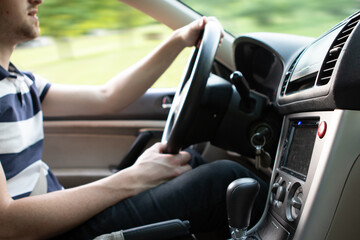 Young man driving in car 