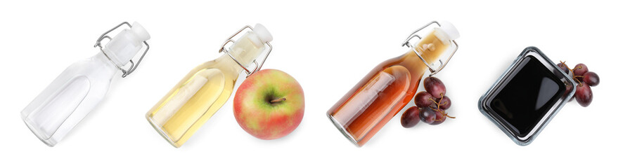 Different types of vinegar in glass bottles isolated on white, top view