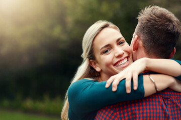Fototapeta premium Smile, portrait and hug outdoor on date, vacation or bonding together on holiday to relax. Happy woman, man and relationship in nature for love, romantic commitment and support of partner in New York
