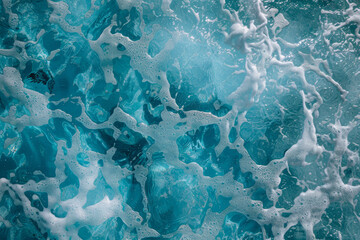 Fototapeta premium The image is of a body of water with a lot of bubbles and foam