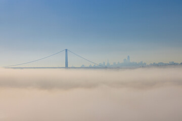 Golden Gate Bridge and San Francisco Skyline with Blue Sky and Fog