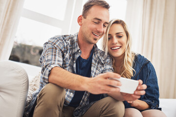 App, gaming and phone with couple on sofa in living room of home together for bonding or fun. Happy, love or smile with gamer man and woman in apartment for online entertainment or video streaming