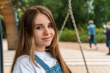 Portrait of a teenage girl in the park.