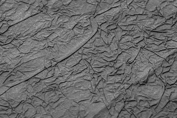 Crumpled matte black paper. Wrapping paper.
Abstrack background, wallpaper. Dark minimalistic...