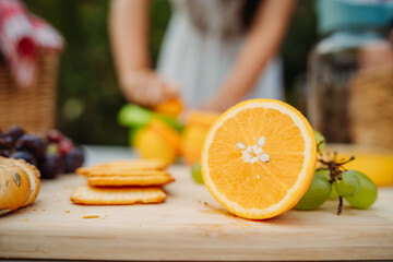 Close up of woman's hands using hand juicer for orange and lemon 