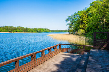 Wooden pier on shore of Wigry lake, Wigry National Park, Podlasie, Poland