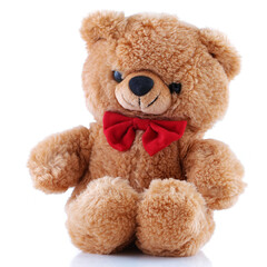 Small Teddy Bear with red bow tie smiling