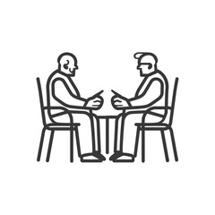 Two Elderly Men Sitting Across from Each Other at a Table