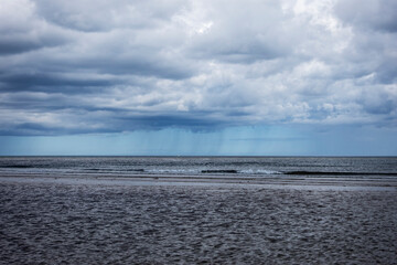 Rainfall over sea with cloud and copy space.