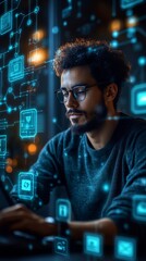 Man wearing glasses is using a laptop, surrounded by holographic digital icons and diagrams, in a dimly lit room