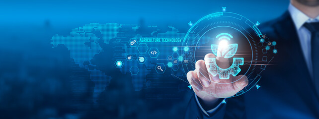 Agriculture Technology concept: Businessman touching sustainability icon on virtual interface, precision farming, data analytics, crop management, resource optimization, innovation, smart irrigation.