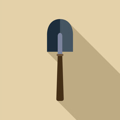 Shovel is casting a long shadow over a beige background