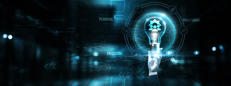 Project Management: Hands of businessman holding light bulb and project management icon with data network digital technology. Task planning, resource allocation, timeline, innovation.