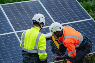 Service engineer inspects and maintains solar panels in a cultivation area, promoting clean energy.