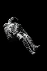 Solitude in Space - A lone astronaut floating in the void of space, captured in dramatic black and white, embodying isolation and exploration.
