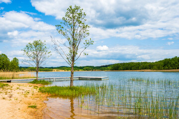 Wooden pier on beach shore of Kamedul lake, Suwalski Landscape Park, Podlasie, Poland