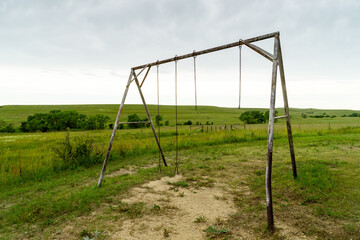 old swing set on prairie