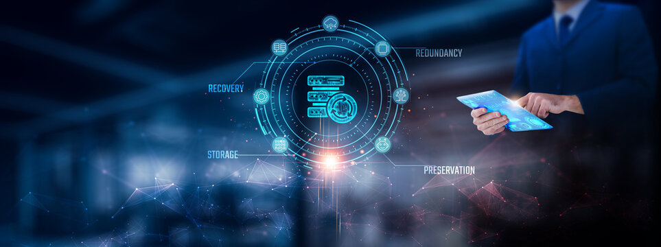 Backup: Businessman using tablet analyzing backup record on tablet. Digital security and network connection on modern virtual screen interface, data recovery, cloud storage, technology, and network.