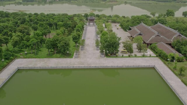 Aerial view of serene buddhist complex with pagoda and lush greenery, Gia Sinh, Ninh Binh, Vietnam.