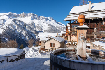 Saint-Veran in winter with snowfall. The third highest village in Europe is located in the Queyras Regional Natural Park, Hautes-Alpes, French Alps, France