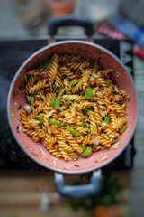 Vegetable paste. Cooking the pasta in Indian style with vegetables and spices.