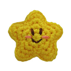 a yellow star crochet doll