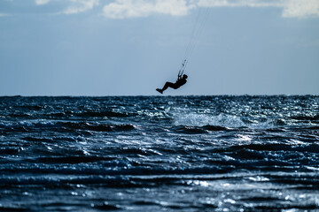 Kite surfing in a windy evening.