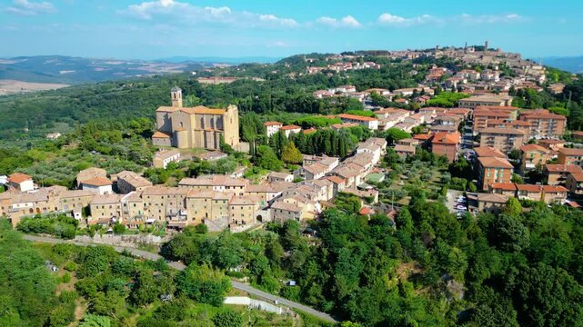 An aerial view of Le Balze di Volterra and the San Giusto Volterra in Tuscany, Italy, captured by a drone. Le Balze di Volterra is a dramatic and unique landscape of steep cliffs