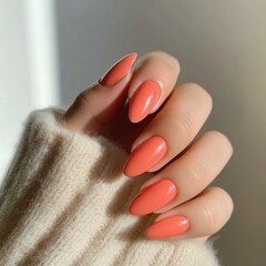 Short nails painted in soft coral