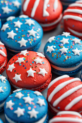 Fototapeta premium A stack of macarons decorated with sprinkles and stars in red, white, and blue colours of American flag